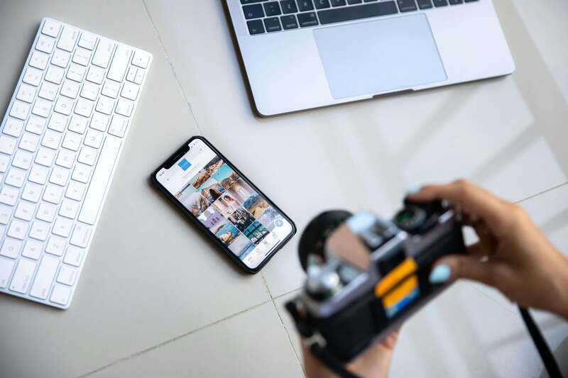 Camera and smartphone displaying high-quality photos for image optimization for social media posting
